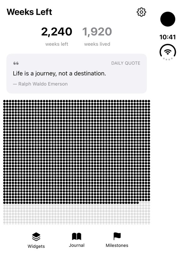 A life calendar app on the closed Duo, in portrait. Stats and a quote sit above a dot grid that continues below the fold. The status bar is on the right edge.